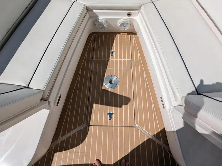  Yacht Photos Pics Intrepid 327 Center Console 2019 boat interior with teak flooring and white seating, 2017 model.