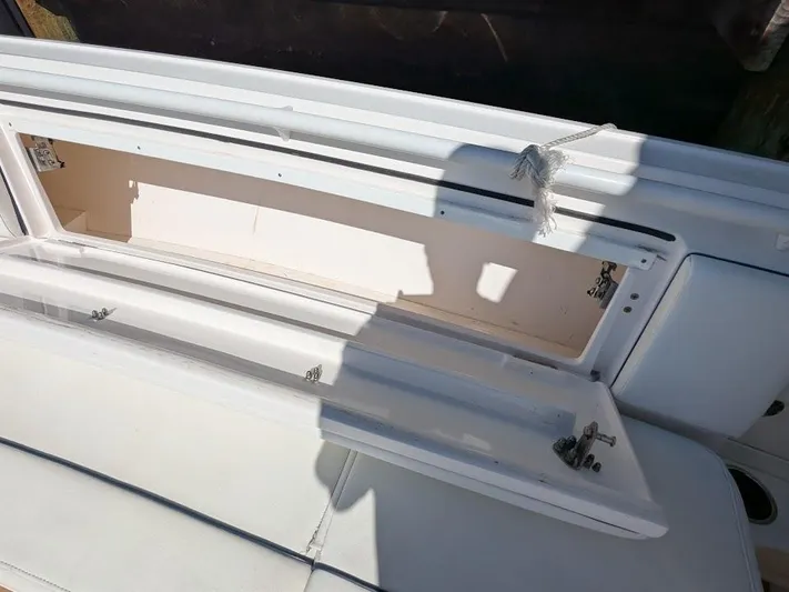  Yacht Photos Pics Open storage compartment on 2017 Intrepid 327 Center Console boat.