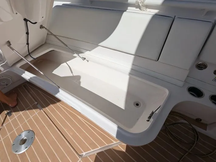  Yacht Photos Pics Open storage compartment on 2017 Intrepid 327 Center Console boat deck.