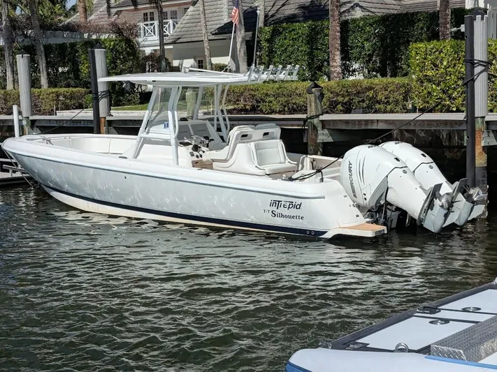  Yacht Photos Pics Intrepid 327 Center Console boat, 2019 model, docked with 400HP motors, side view.