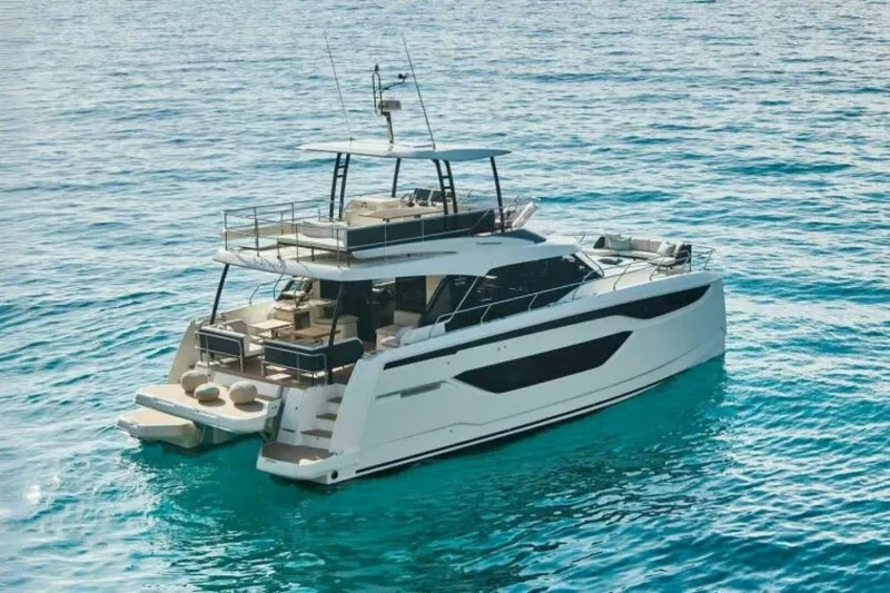 New 2026 Prestige M48 Multihull Yacht Photos Pics Luxurious 2026 Prestige M48 yacht cruising on clear blue waters.