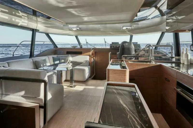 New 2026 Prestige M48 Multihull Yacht Photos Pics Luxurious interior of 2026 Prestige M48 yacht with modern furnishings and ocean view.