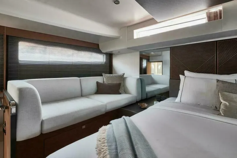 New 2026 Prestige M48 Multihull Yacht Photos Pics Luxurious interior of 2026 Prestige M48 yacht with elegant seating and bedding.