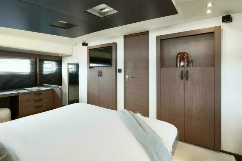 New 2026 Prestige M48 Multihull Yacht Photos Pics Luxurious bedroom interior of 2026 Prestige M48 yacht with modern wood finishes.