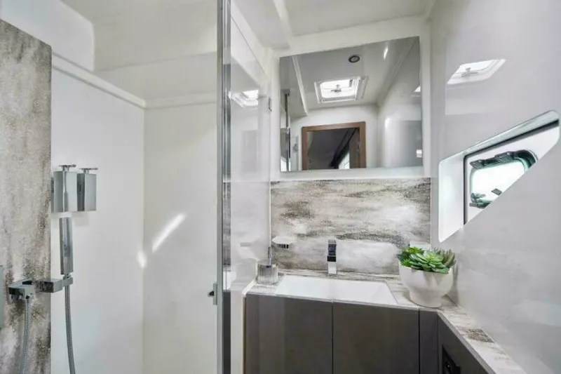 New 2026 Prestige M48 Multihull Yacht Photos Pics Luxurious bathroom in 2026 Prestige M48 yacht, featuring modern fixtures and elegant design.