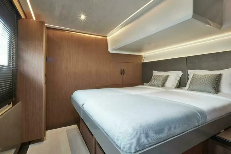 New 2026 Prestige M48 Multihull Yacht Photos Pics Luxurious bedroom interior of 2026 Prestige M48 yacht with modern design and ambient lighting.