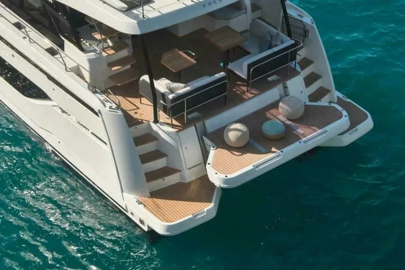 New 2026 Prestige M48 Multihull Yacht Photos Pics Luxury Prestige M48 yacht, 2026 model, with elegant deck on turquoise water.