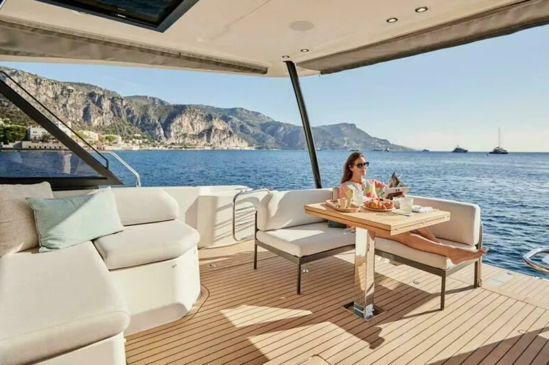 New 2026 Prestige M48 Multihull Yacht Photos Pics Luxury yacht Prestige M48, 2026 model, with scenic ocean view and relaxing passenger.