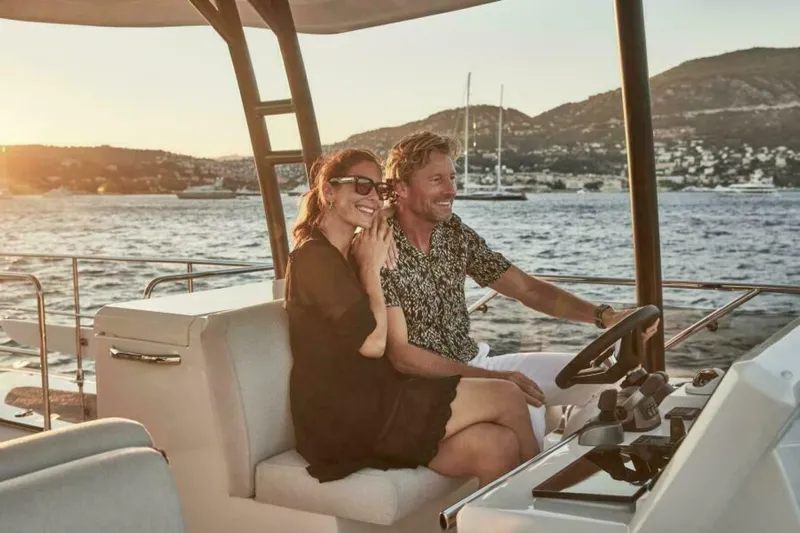 New 2026 Prestige M48 Multihull Yacht Photos Pics Couple enjoying a sunset cruise on a 2026 Prestige M48 yacht.