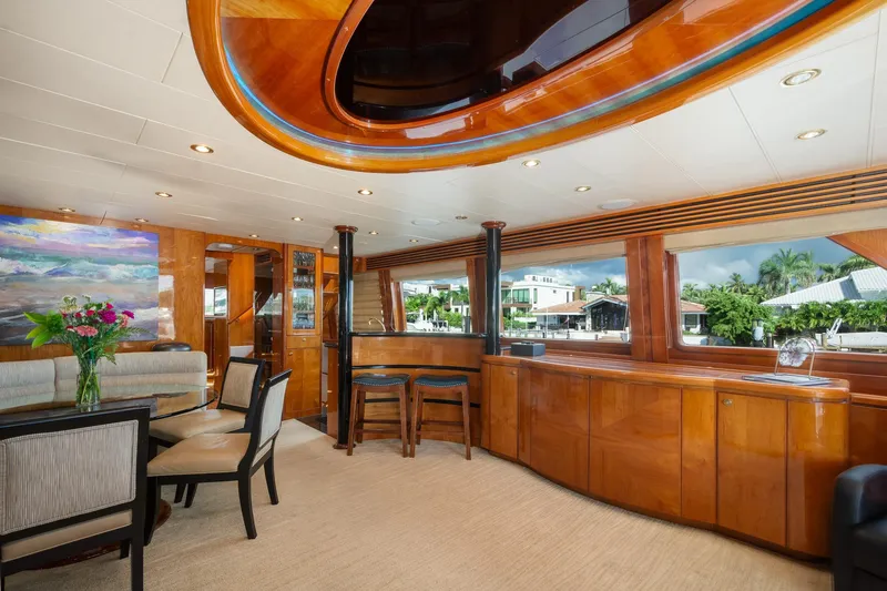 Kismet Yacht Photos Pics Luxurious 2003 Hargrave Skylounge interior with elegant wood finishes and panoramic windows.