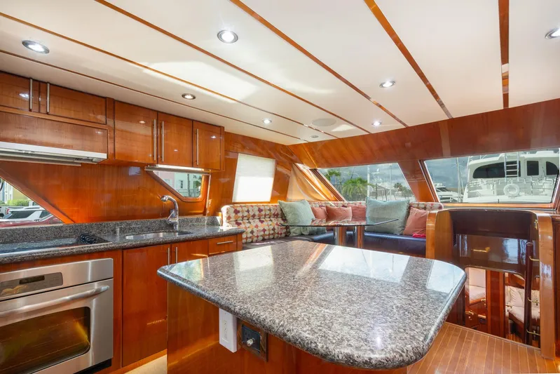 Kismet Yacht Photos Pics Luxurious 2003 Hargrave Skylounge yacht interior with modern kitchen and seating area.
