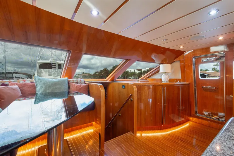 Kismet Yacht Photos Pics Luxurious 2003 Hargrave Skylounge interior with polished wood and elegant decor.