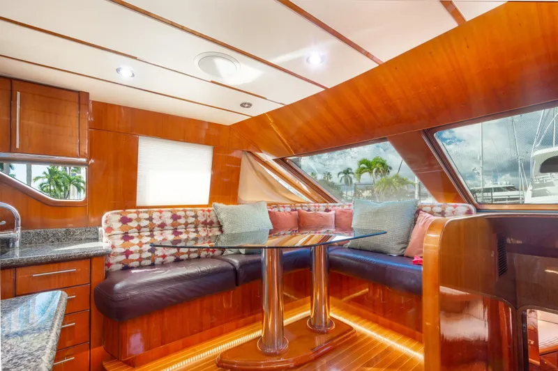 Kismet Yacht Photos Pics Luxurious 2003 Hargrave Skylounge yacht interior with plush seating and elegant wood finishes.