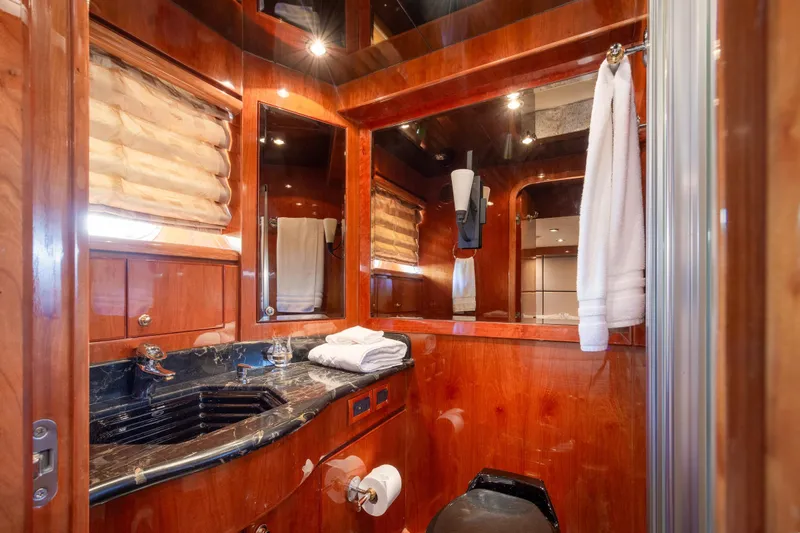 Kismet Yacht Photos Pics Luxurious bathroom in 2003 Hargrave Skylounge yacht with wood accents and marble sink.