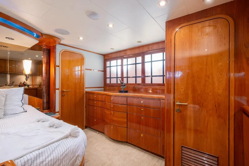 Kismet Yacht Photos Pics Luxurious 2003 Hargrave Skylounge yacht interior with elegant wood finishes and cozy bedroom.