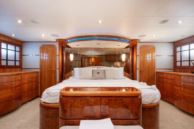 Kismet Yacht Photos Pics Luxurious 2003 Hargrave Skylounge yacht bedroom with elegant wood finishes and ambient lighting.
