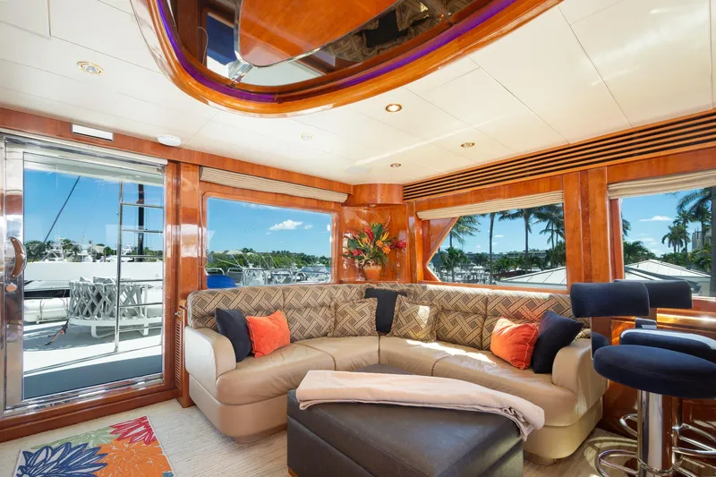 Kismet Yacht Photos Pics Luxurious interior of 2003 Hargrave Skylounge yacht with plush seating and scenic views.