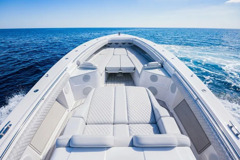  Yacht Photos Pics 2024 HCB 53 Suenos luxury boat with spacious seating on open ocean.