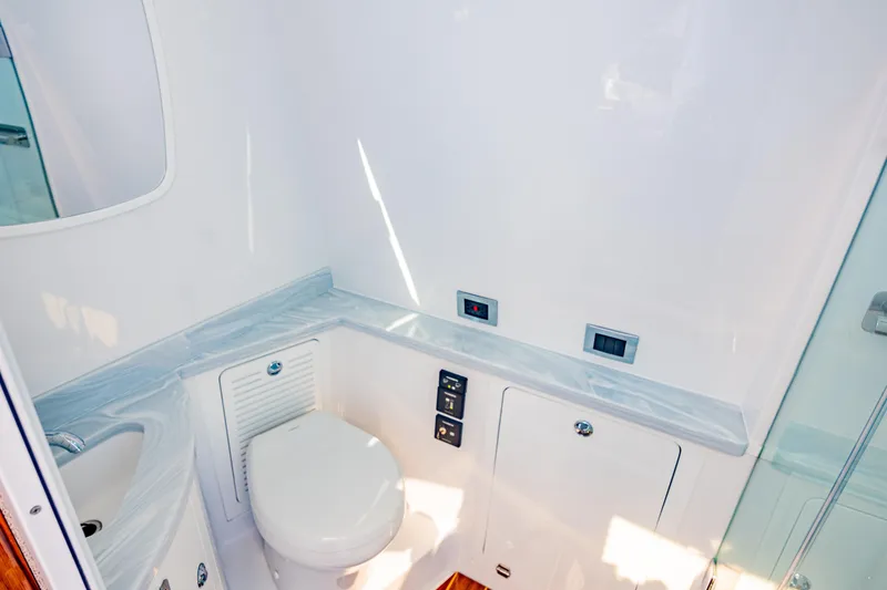  Yacht Photos Pics Luxurious bathroom interior of 2024 HCB 53 Suenos yacht with modern fixtures.