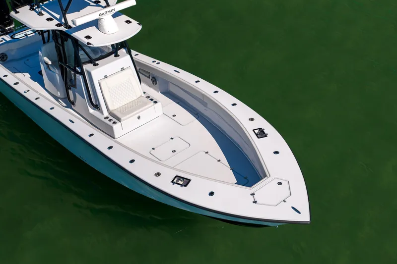  Yacht Photos Pics 2025 Conch 33 boat on green water, featuring sleek design and modern equipment.