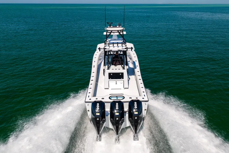  Yacht Photos Pics 2025 Conch 33 boat cruising on open water with powerful engines.