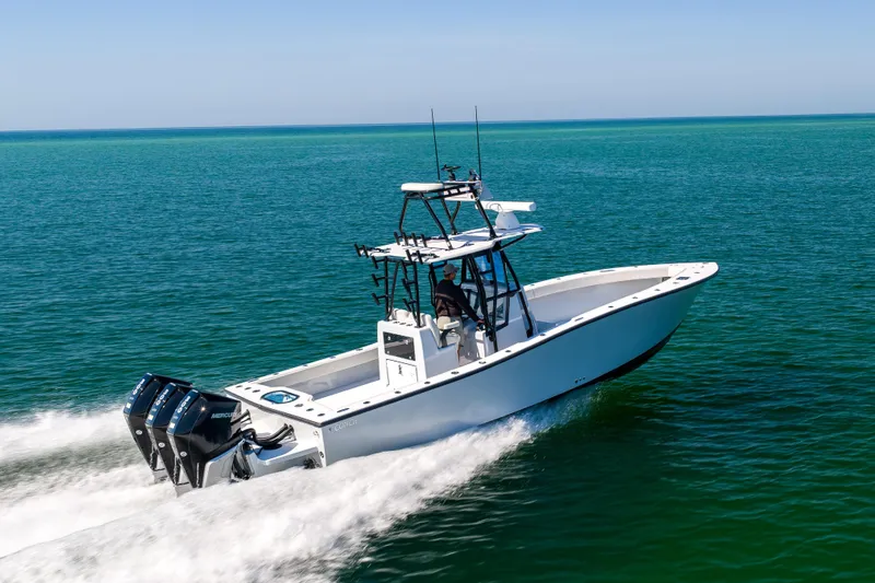  Yacht Photos Pics 2025 Conch 33 boat cruising on open water with dual engines.