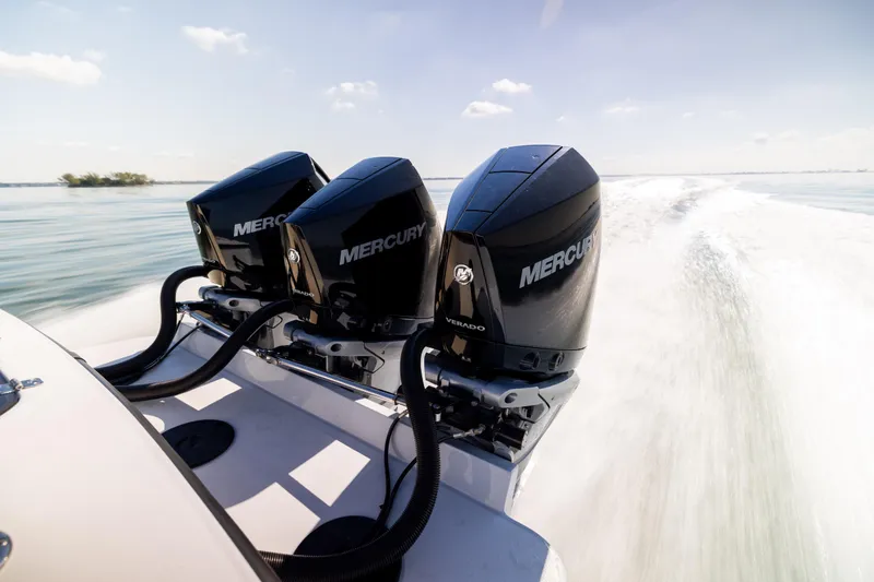  Yacht Photos Pics Triple Mercury outboard engines on 2025 Conch 33 boat, speeding on open water.