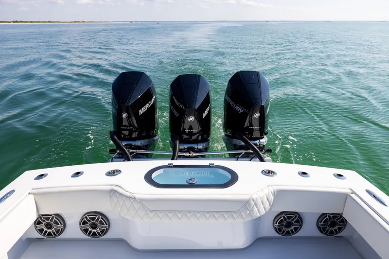  Yacht Photos Pics 2025 Conch 33 boat with triple Mercury engines on open water.