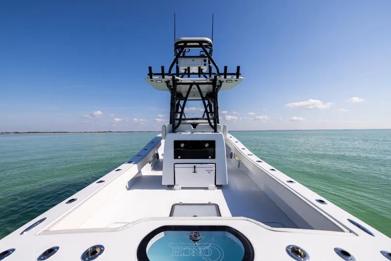  Yacht Photos Pics 2025 Conch 33 boat on calm sea under clear blue sky.