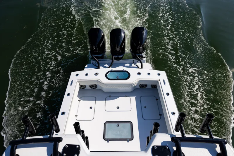  Yacht Photos Pics Aerial view of 2025 Conch 33 boat with triple engines on water.
