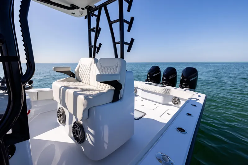  Yacht Photos Pics 2025 Conch 33 boat with triple Mercury engines on open sea.