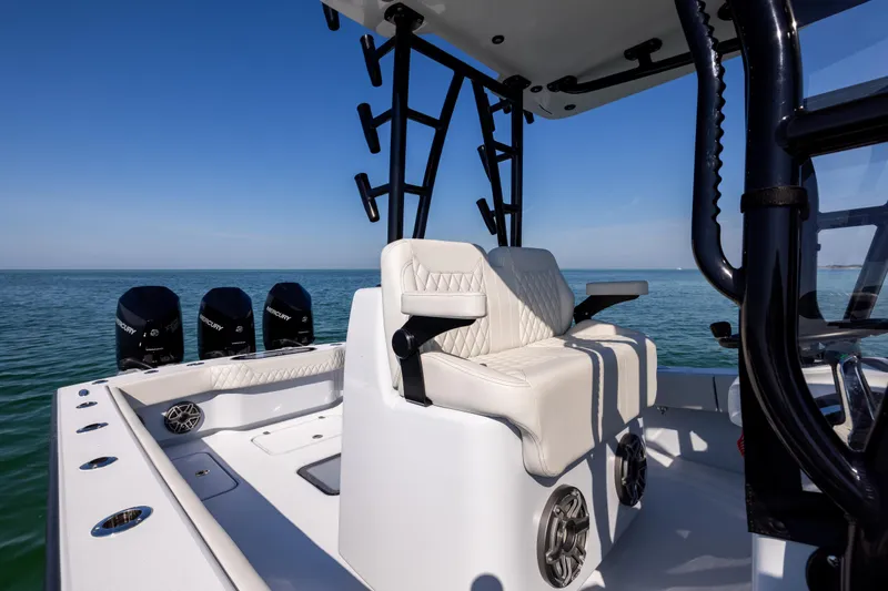  Yacht Photos Pics 2025 Conch 33 boat interior with seating and multiple outboard engines.