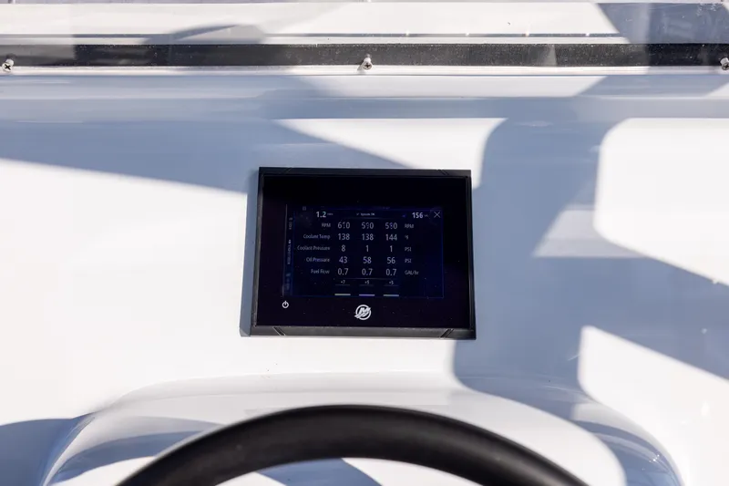  Yacht Photos Pics Digital display on 2025 Conch 33 boat dashboard showing engine metrics.