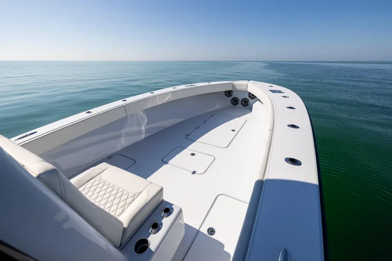 Yacht Photos Pics 2025 Conch 33 boat on calm sea, featuring sleek design and spacious deck.