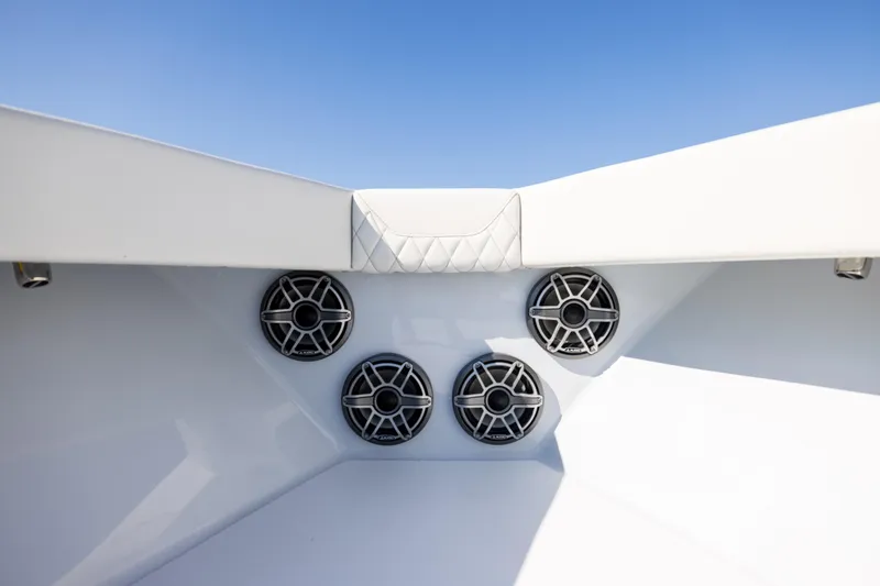  Yacht Photos Pics 2025 Conch 33 boat speakers and seating detail under clear blue sky.