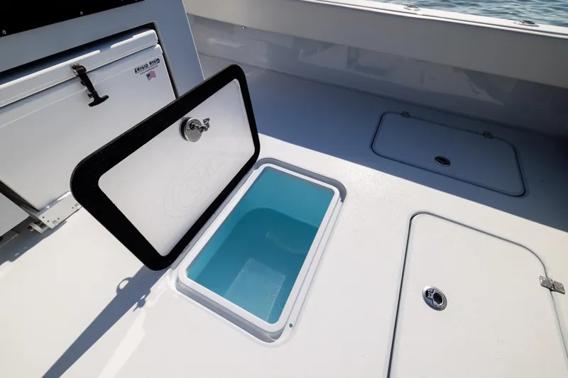  Yacht Photos Pics Open storage compartment on 2025 Conch 33 boat deck.