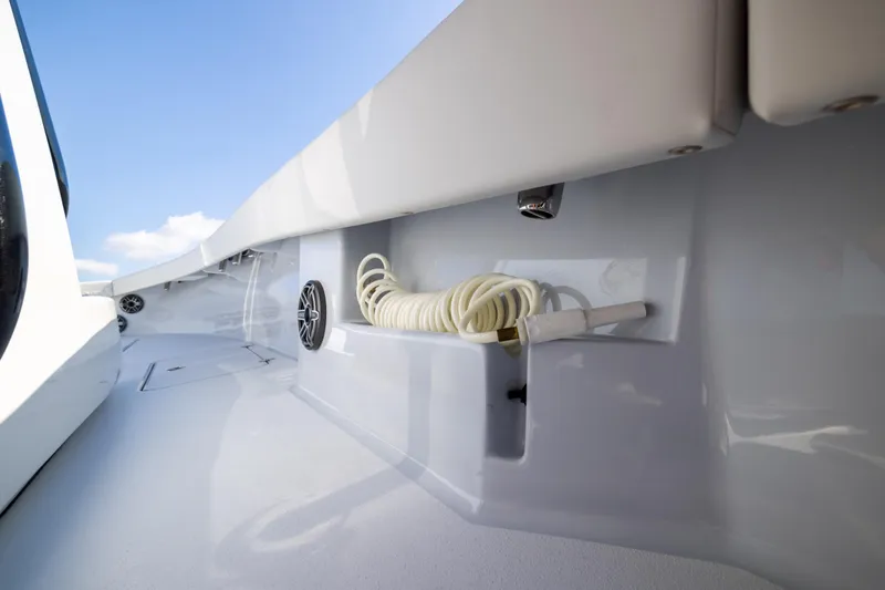  Yacht Photos Pics 2025 Conch 33 boat deck with coiled hose and speaker.