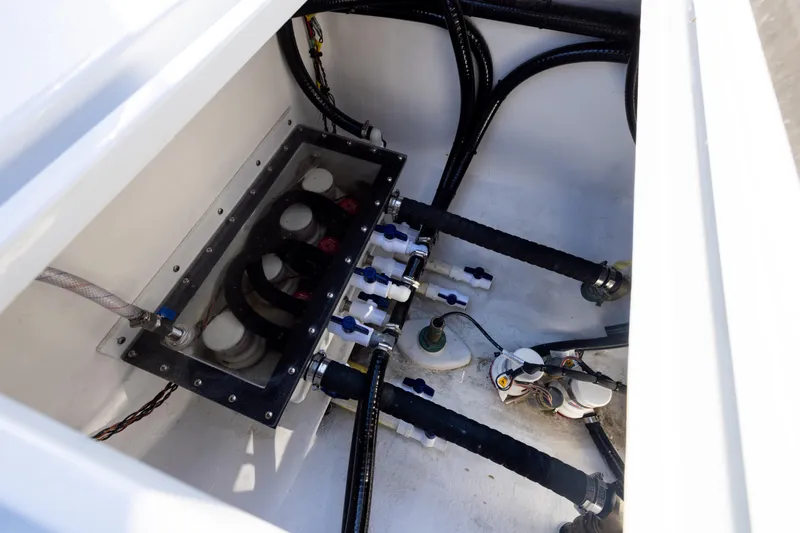  Yacht Photos Pics Engine compartment of 2025 Conch 33 boat, showcasing hoses and wiring.