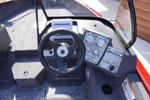 2025 Tracker Pro Guide V-175 Combo boat dashboard with steering wheel and gauges.
