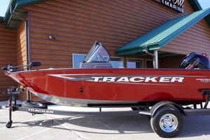 2025 Tracker Pro Guide V-175 Combo boat on trailer, red exterior, parked outside.