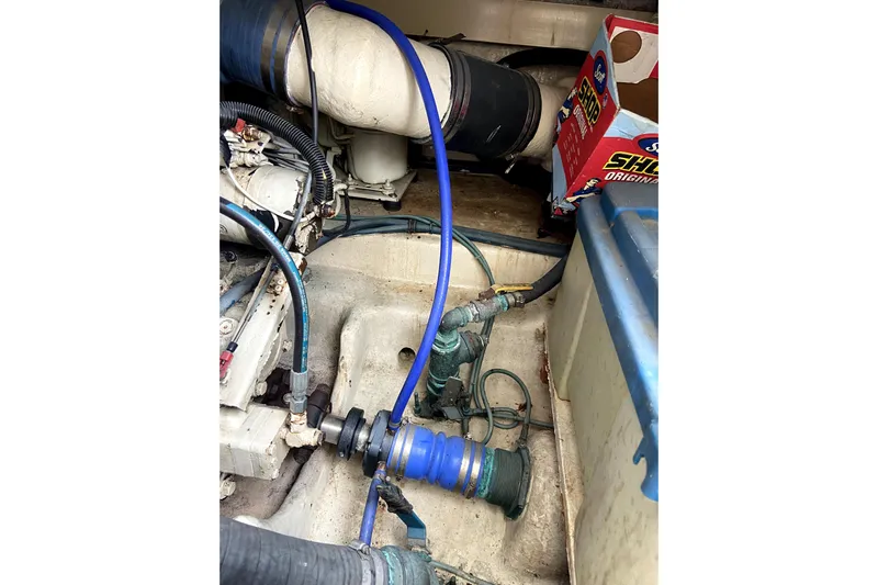 Belle La Vie Sur La Mer Yacht Photos Pics Engine room of 2001 Egg Harbor 37 Convertible with visible hoses and components.