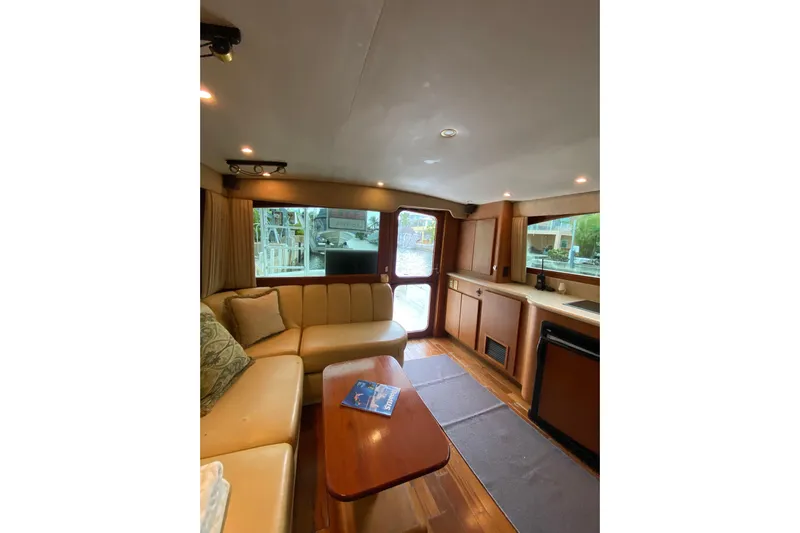 Belle La Vie Sur La Mer Yacht Photos Pics Interior of 2001 Egg Harbor 37 Convertible yacht with cozy seating and kitchenette.
