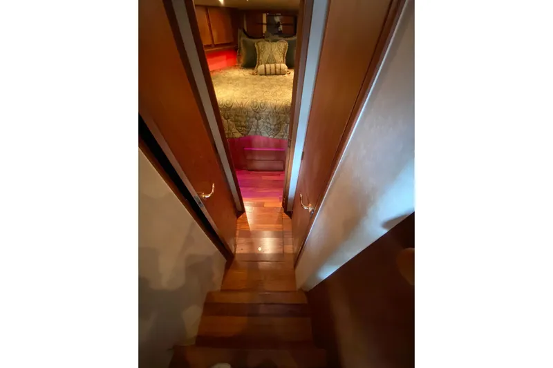 Belle La Vie Sur La Mer Yacht Photos Pics Interior view of 2001 Egg Harbor 37 Convertible yacht bedroom with wooden flooring.