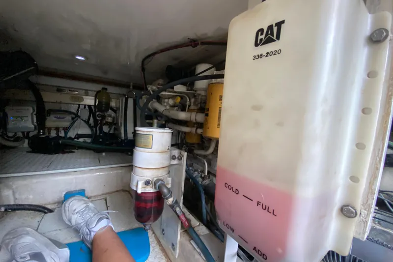 Belle La Vie Sur La Mer Yacht Photos Pics Engine room of 2001 Egg Harbor 37 Convertible with CAT components and maintenance equipment.