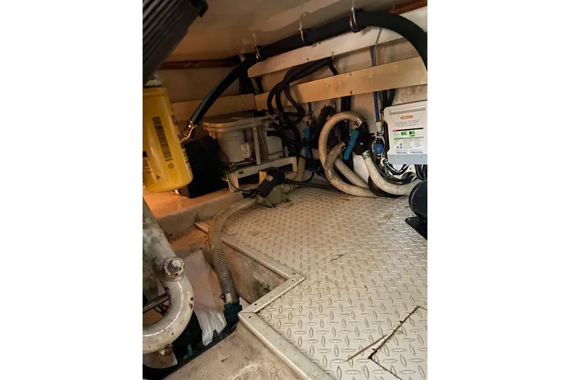 Belle La Vie Sur La Mer Yacht Photos Pics Engine room of 2001 Egg Harbor 37 Convertible with mechanical components and wiring.