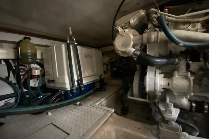 Belle La Vie Sur La Mer Yacht Photos Pics Engine room of 2001 Egg Harbor 37 Convertible boat, featuring machinery and components.