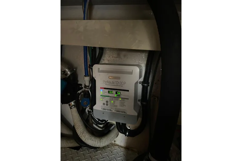 Belle La Vie Sur La Mer Yacht Photos Pics ProNautic 1230P charger in 2001 Egg Harbor 37 Convertible engine room.