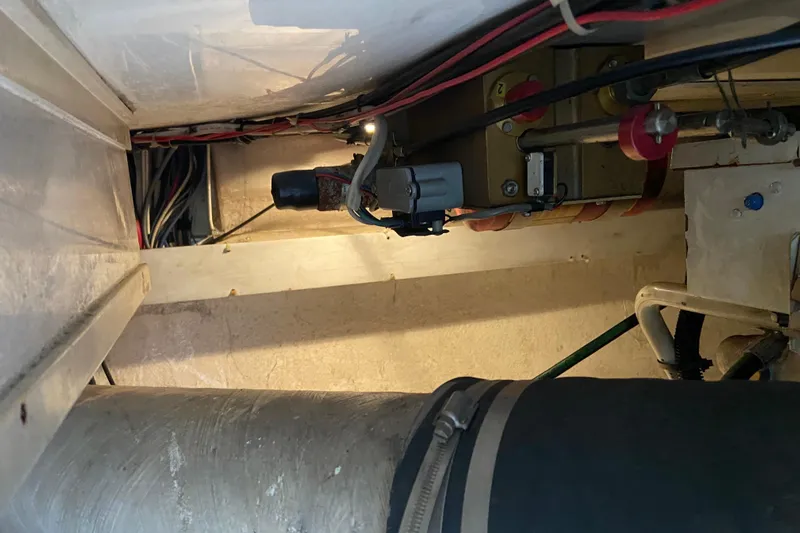 Belle La Vie Sur La Mer Yacht Photos Pics Engine compartment of a 2001 Egg Harbor 37 Convertible boat, showing wiring and components.