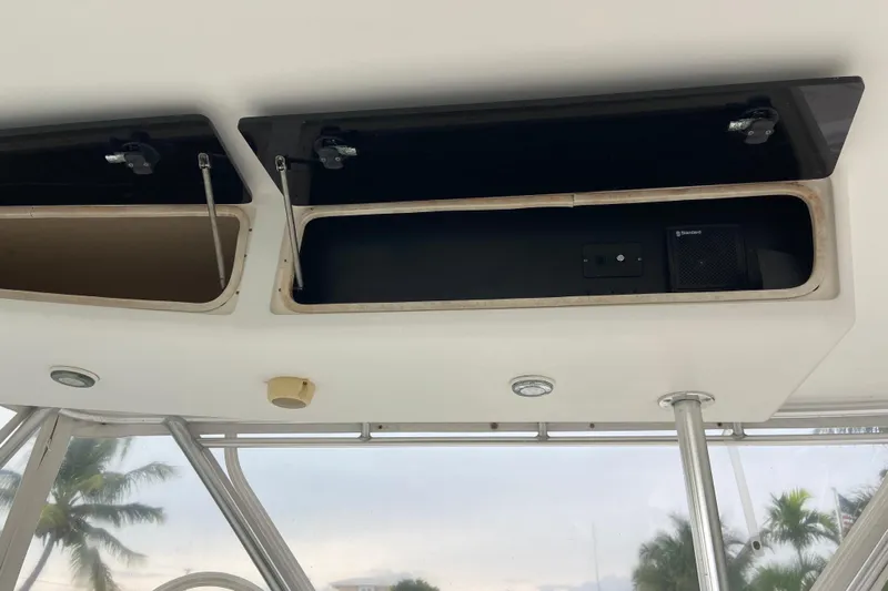 Belle La Vie Sur La Mer Yacht Photos Pics Open storage compartments on a 2001 Egg Harbor 37 Convertible boat interior.