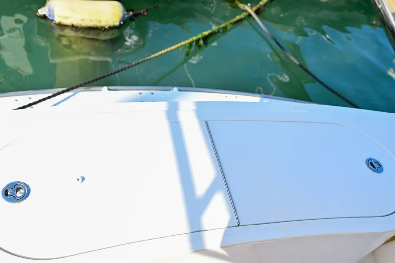 Caraibi Yacht Photos Pics 2013 Hatteras GT63 yacht deck with water and mooring lines visible.